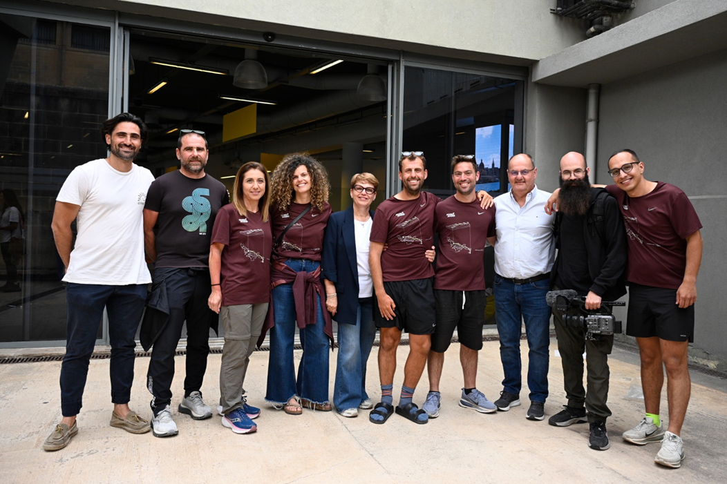 Zach Vella surrounded by his crew, friends and family members as he arrived in Malta. Photo: Matthew Mirabelli